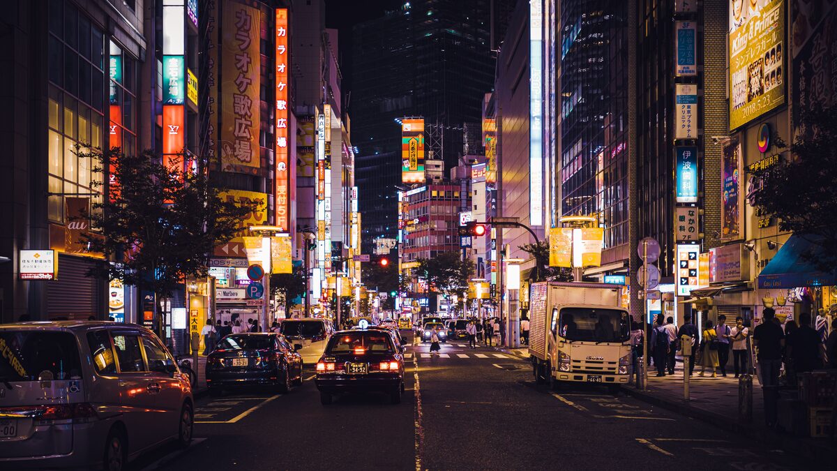 Bright colorful cityscape at dusk with a nostalgic anime feel