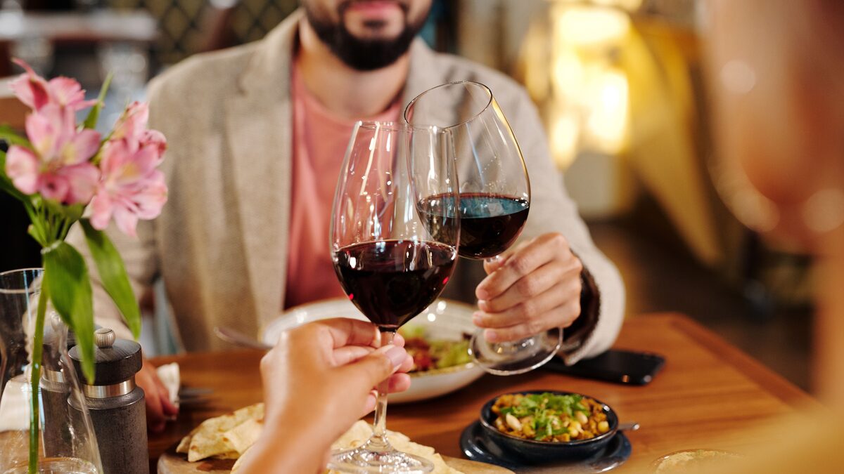 a couple toasting with wine at an anniversary celebration
