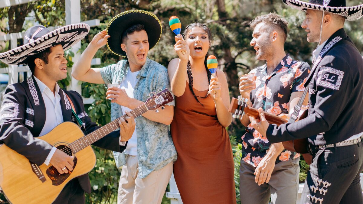 Dancers moving together at an outdoor Latin music party