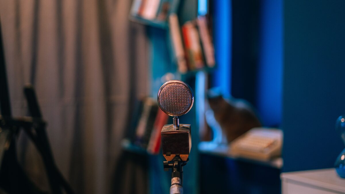Person wearing headphones in a quiet, softly lit room