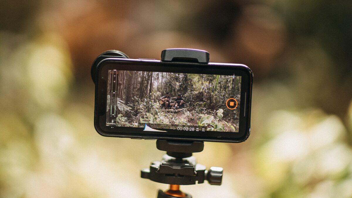 a smartphone on a tripod filming content