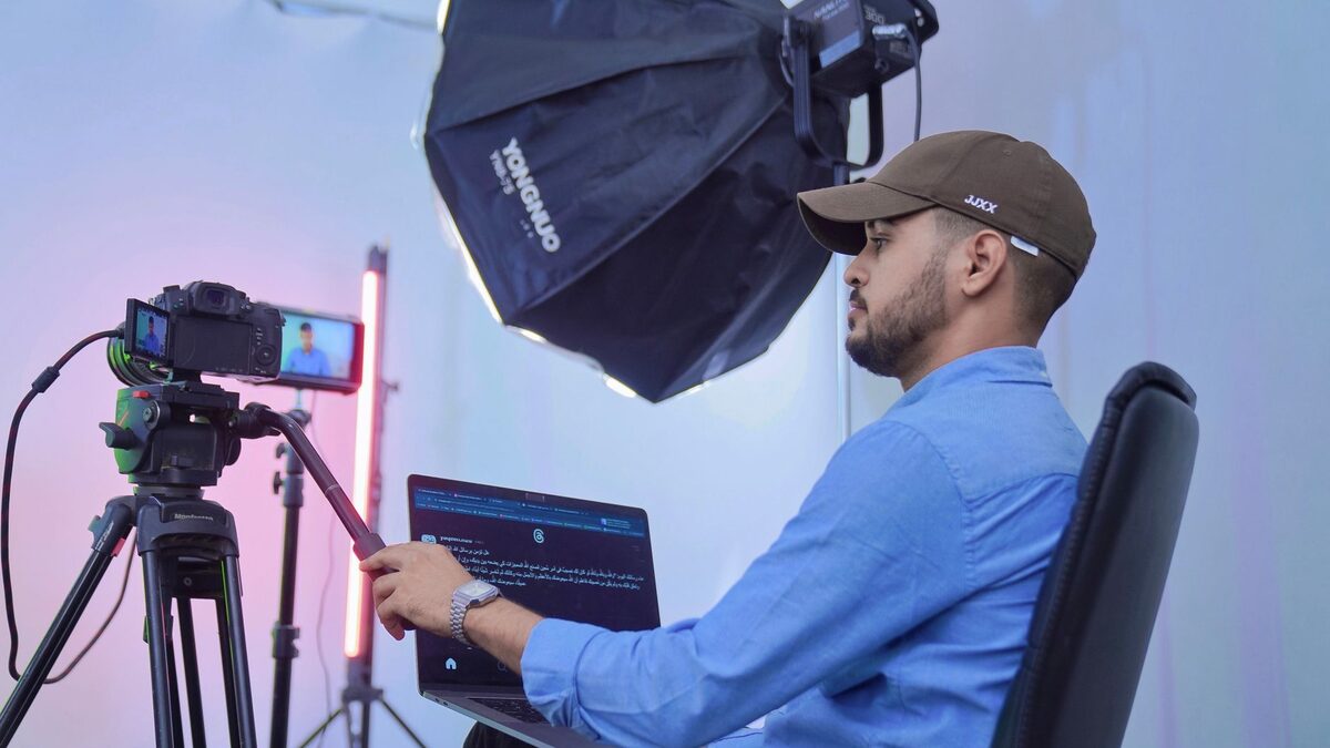 A creator recording a video, adding AI music for YouTube