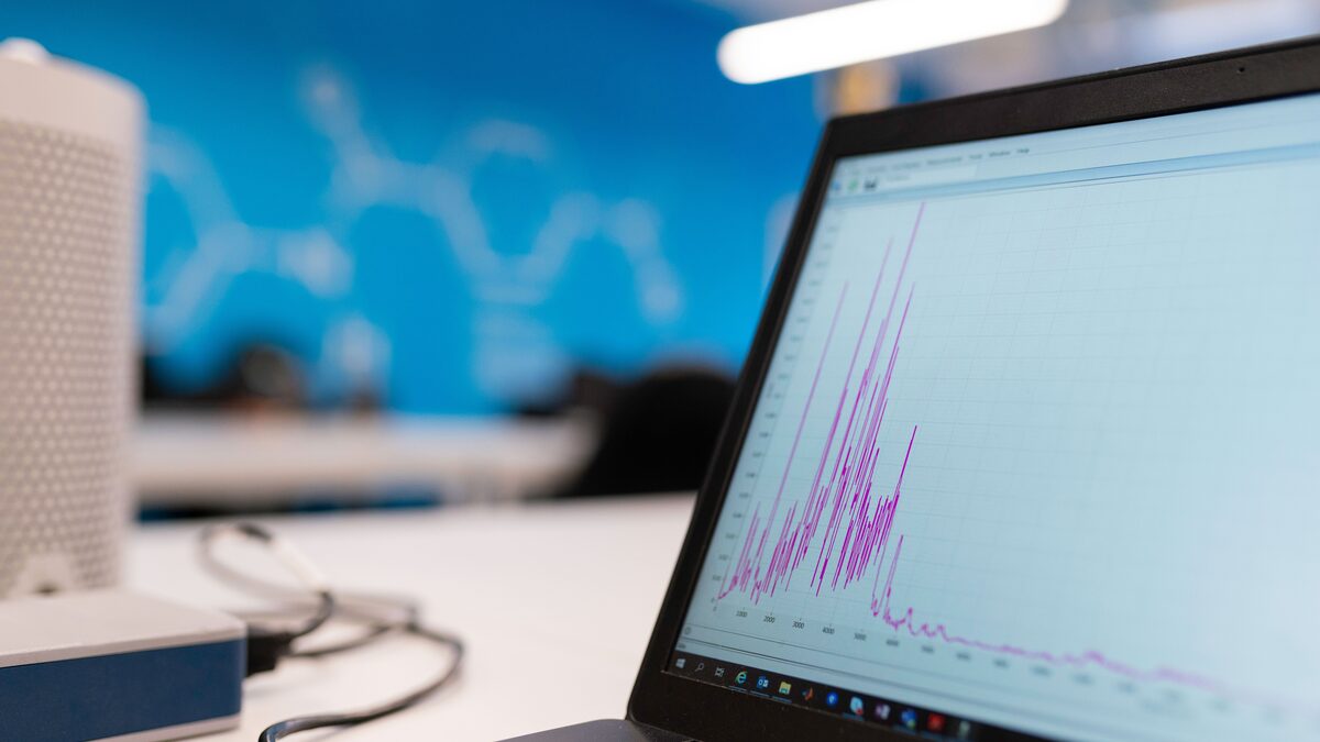 A person reading charts and data about music trends on a screen