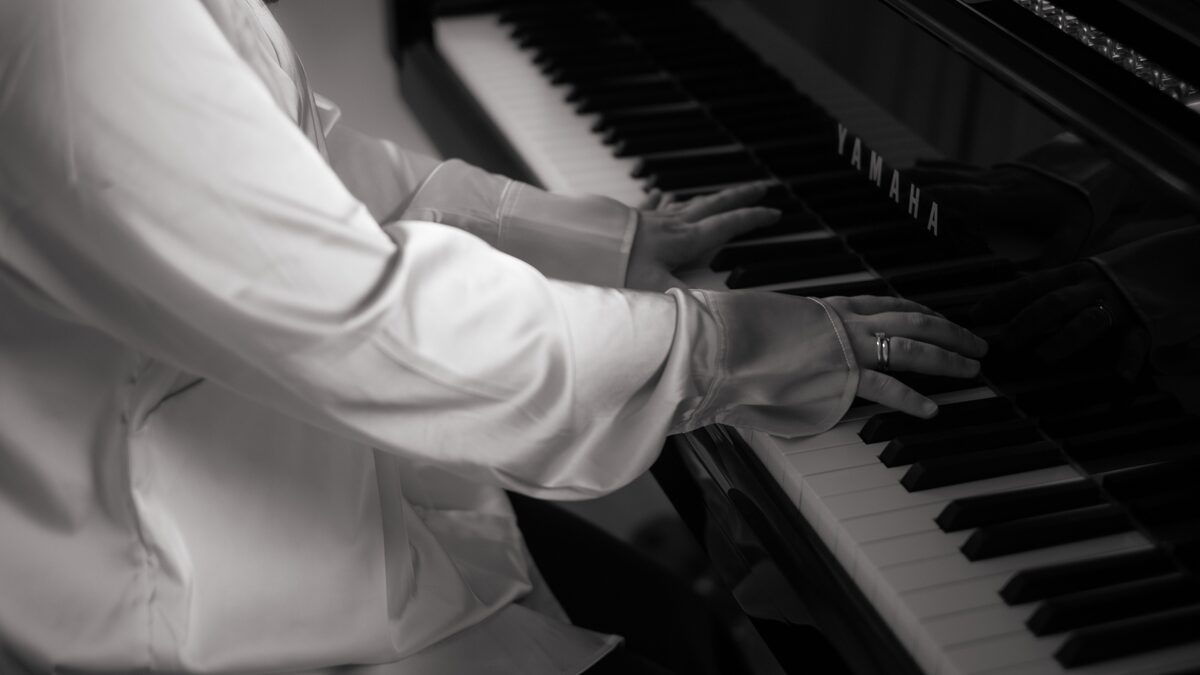 Close view of a grand piano keyboard in soft window light
