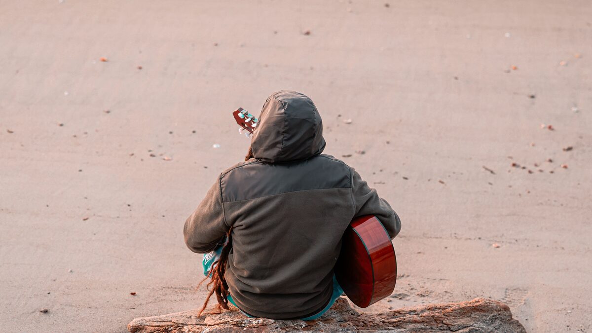 A vintage electric guitar and amp bathed in warm golden light