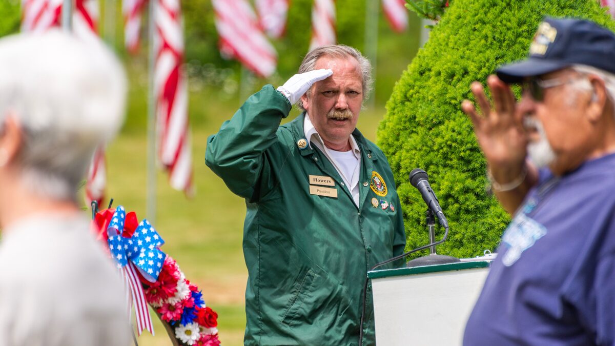 A folded flag and medals honoring a veteran's service