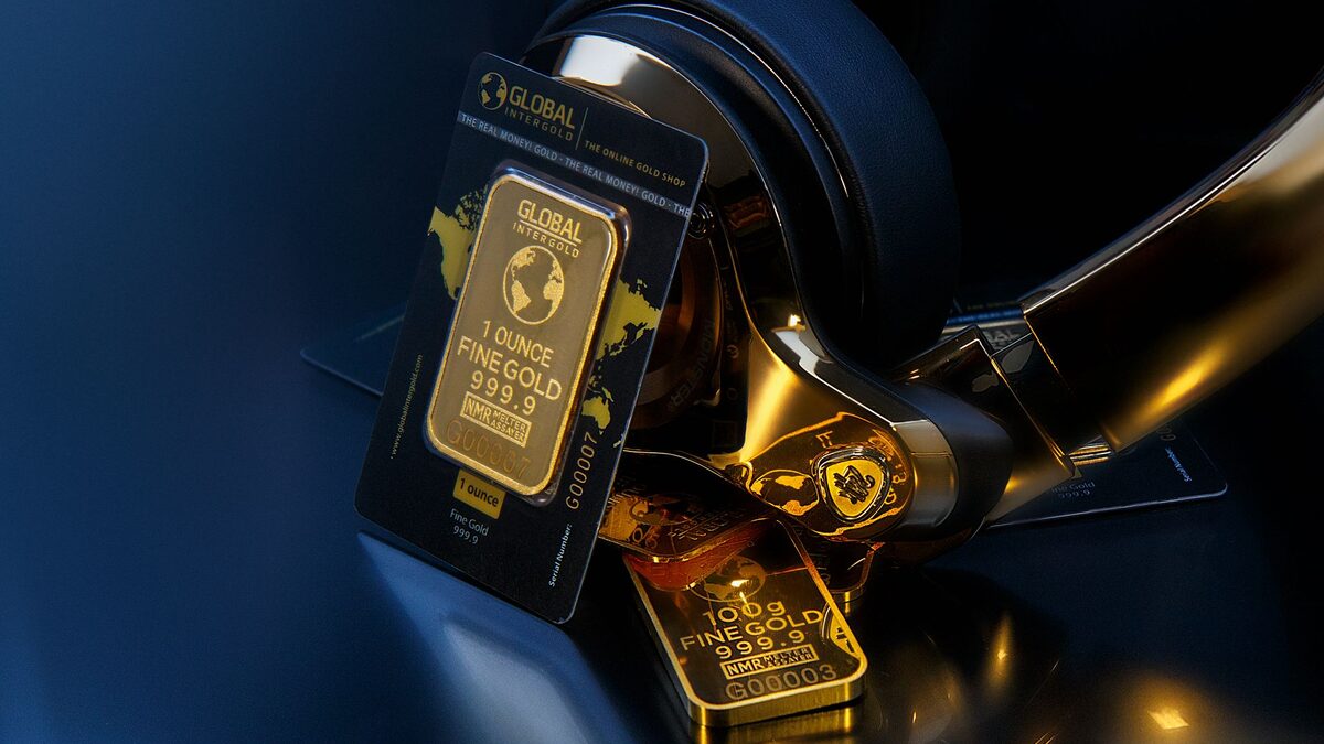 Headphones beside gold, a nod to selling Suno AI songs and commercial rights