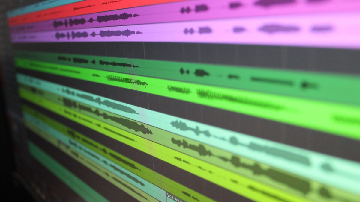 Multitrack audio on a screen, like extending and remixing a song in Suno