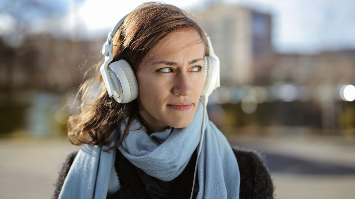 Person listening to music, illustrating a Mubert review